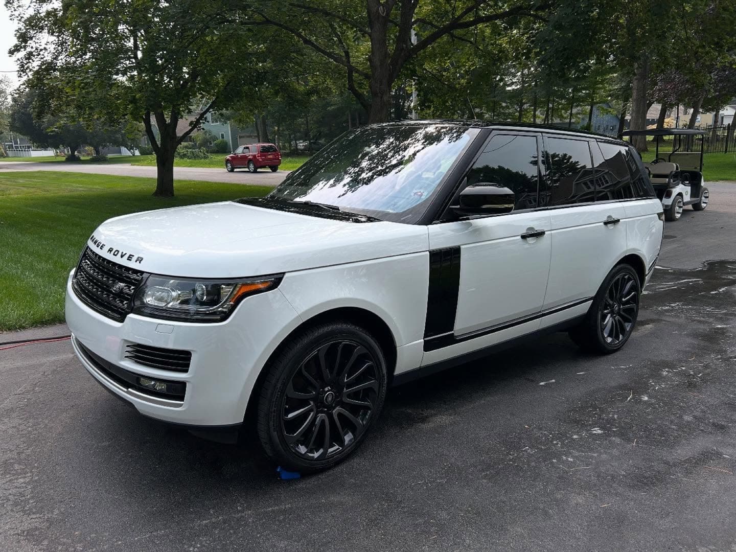 Glossy black vehicle protected with a ceramic coating