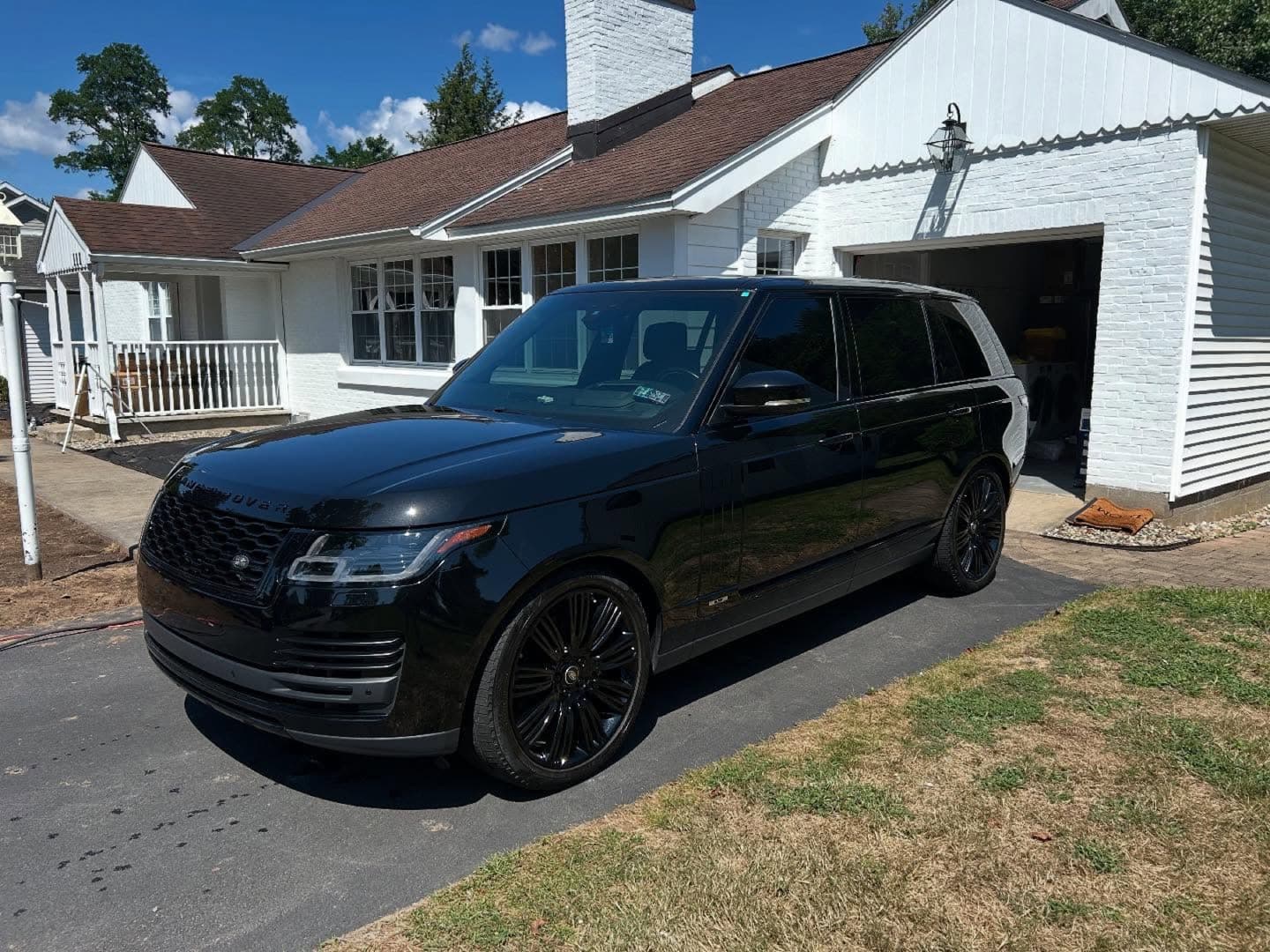 Professional mobile detailer cleaning a vehicle at a Tampa Bay home