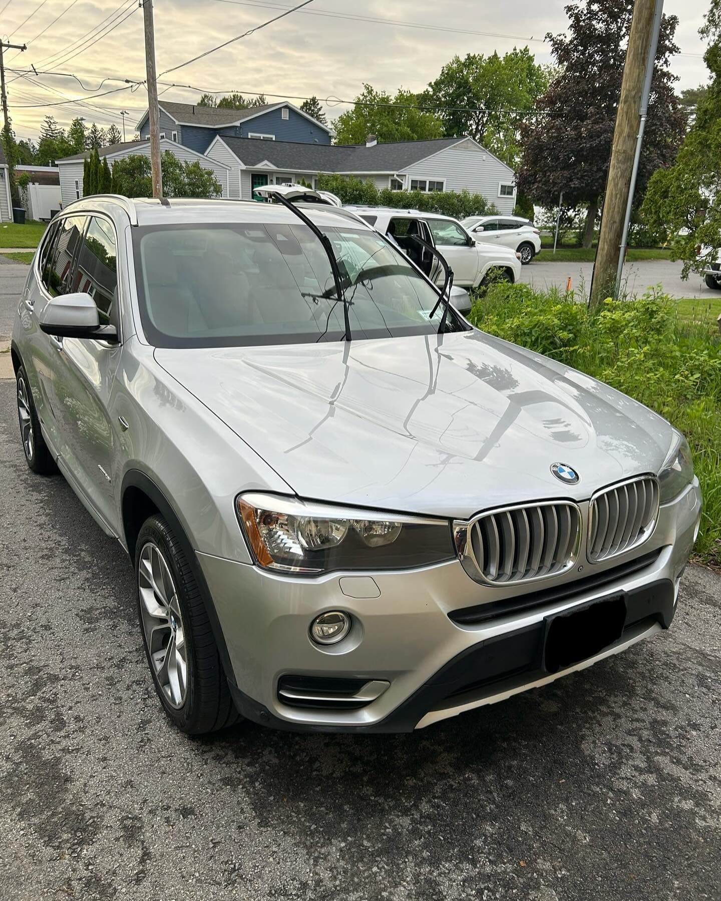 Detailer polishing automotive paint during correction